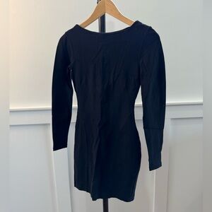 H&M long sleeve tight mini dress. Scooped back and stitching detail